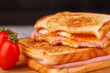 Colorful Display of Sandwiches and Cherry Tomatoes on a Black Background with Napkin