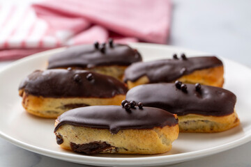 Traditional french eclairs with chocolate.