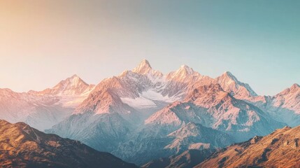 Fototapeta premium Majestic sunset illuminates snow-capped mountain range.