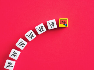 Online shopping with mouse clicking buy button on cubes