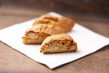 Cantuccini (Italian cookies) on dark wooden background. Close up