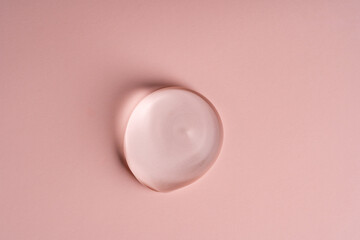 An Elegant Soft Pink gel drop Gracefully Resting on a Smooth Surface with Great Visual Appeal