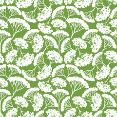 Seamless green and white floral pattern. White wild flowers silhouettes on a green background. Vector floral print