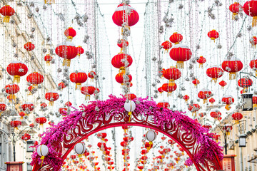 Chinese red Christmas lanterns on Kamergersky Lane in Moscow. The decoration of the city. The first ever meeting of the Chinese New Year 2024 in Moscow.