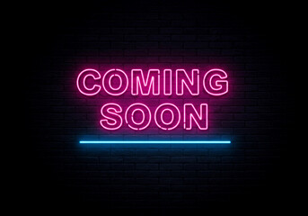 Prepare for the excitement with this neon "COMING SOON" sign, showcased in striking pink and teal hues against a textured brick wall, perfect for building anticipation for new releases or events.