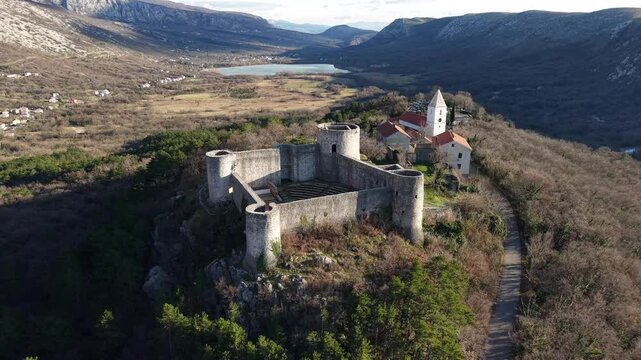 panoramic view of the Drivenik Castle in the northern part of the Adriatic Sea, Croatia and Vinodolska dolina surrounded by high mountains 