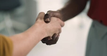 Two business women shake hands during meeting, close up. Gesture of making profitable deal, congratulates each other with reached agreement. Client and manager start or finish negotiations, commitment