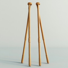Two light brown wooden tripod stands isolated on white background.