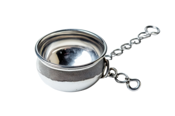An elegant silver tea infuser resting on a smooth surface, ready for brewing a delightful tea blend