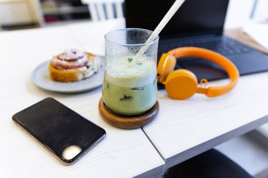 Matcha latte kept on table in cafe