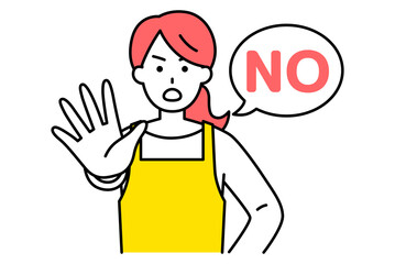 右手を前に出してNOと言うエプロン姿の女性