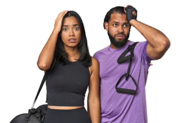 Young Latino couple ready for gym training being shocked, she has remembered important meeting.
