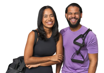 Young Latino couple ready for gym training laughing and having fun.