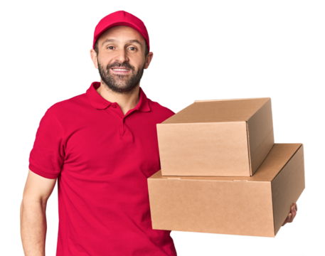 Hispanic male courier with boxes happy, smiling and cheerful.