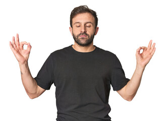 Fototapeta premium Studio portrait of young Hispanic male relaxes after hard working day, she is performing yoga.