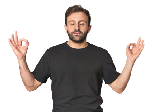 Studio portrait of young Hispanic male relaxes after hard working day, she is performing yoga.