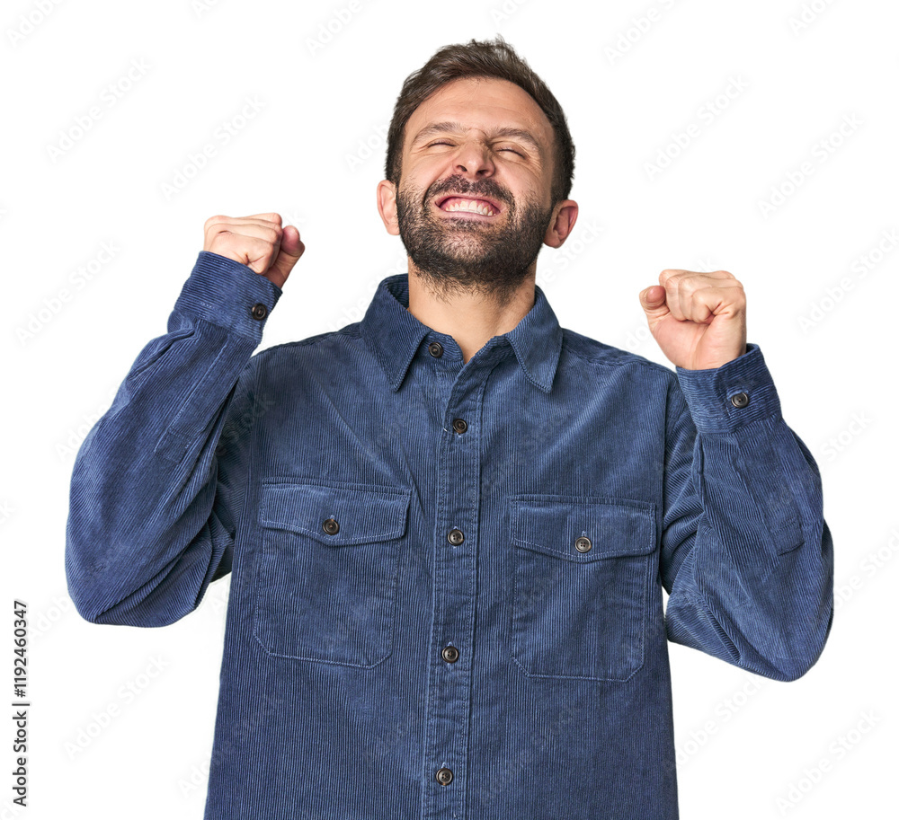 Wall mural Studio portrait of young Hispanic male celebrating a victory, passion and enthusiasm, happy expression.