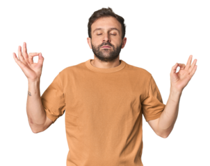 Studio portrait of young Hispanic male relaxes after hard working day, she is performing yoga.