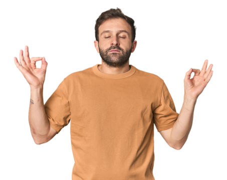 Studio portrait of young Hispanic male relaxes after hard working day, she is performing yoga.