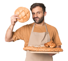 Hispanic male baker with bread tray in studio