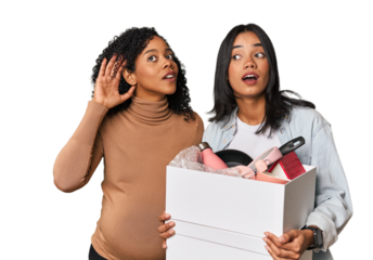 Latin women couple moving, one pregnant  trying to listening a gossip.