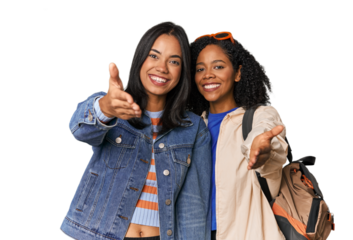 Latin friends ready for vacation stretching hand at camera in greeting gesture.