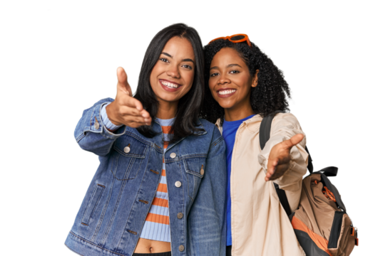 Latin friends ready for vacation stretching hand at camera in greeting gesture.
