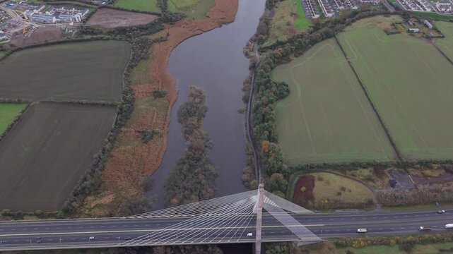 A wide-angle aerial view of the Mary McAleese Boyne Valley Bridge spanning the River Boyne