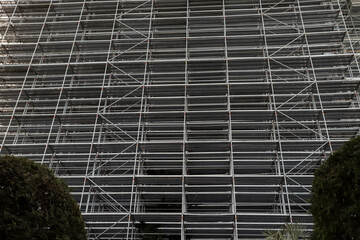 Metal Scaffolding on Building Facade, steel framework assembly, industrial design