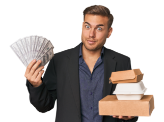 Young man holds dollars and fast food, showcasing finance and indulgence