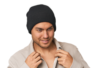 Close-up of a young man in a wool hat, showcasing winter fashion