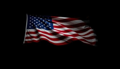 An American flag waving in the wind on a dark black background