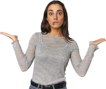 Hispanic young woman confused and doubtful shrugging shoulders to hold a copy space.