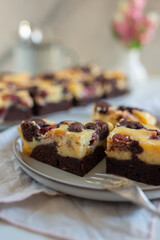 Chocolate cheesecake layered with brownie and dark cherrie
