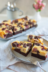 Chocolate cheesecake layered with brownie and dark cherrie
