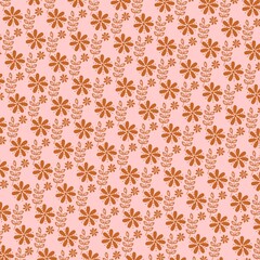 Pink and brown ditsy daisy seamless floral pattern with hand-drawn flowers and leaves. Great for fabric, nursery decor, wrapping paper and wallpaper.