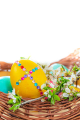 Easter basket with eggs on white background