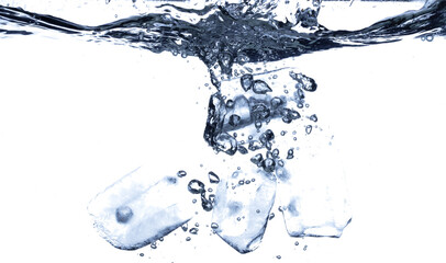 Splashing ice tubes scattered in water creating a dynamic air bubbles motion effect. Isolated white...