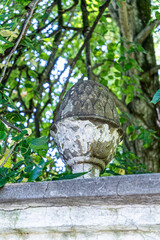 Artichoke as decoration in old architecture. Fence vintage decor.