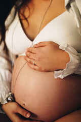 pregnant woman holding belly