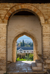 Naklejka premium View of Ioannina through the arch in Mosque Museum Arslan Pasha in the Old Castle in Ioannina, Greece 
