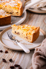 Homemade roasting apple cake with almonds and pudding filling