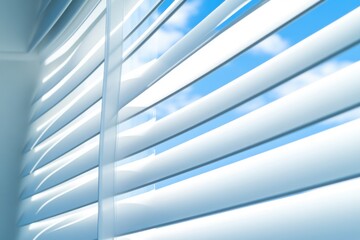 Obraz premium A close-up shot of white blinds on a window, providing a simple and clean design element