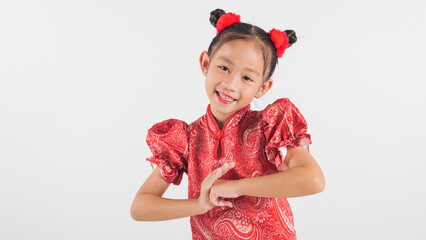 Happy Chinese New Year Asian girl in traditional red cheongsam qipao dress making a congratulatory gesture. Perfect for festive themes, isolated on a white