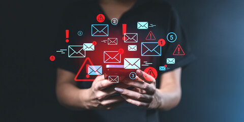 Smartphone with email and spam notifications overlaid digitally.