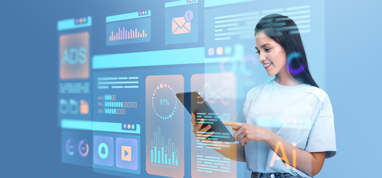 Woman interacting with virtual data interface on tablet, futuris