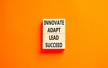Innovate adapt lead succeed symbol. Concept words Innovate Adapt Lead Succeed on beautiful wooden...