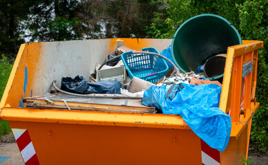 Containers with construction rubble and garbage during the renovation of a house