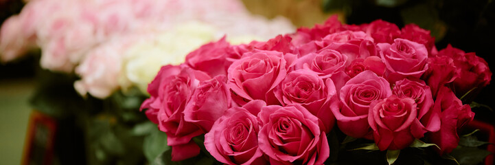 Website banner with huge pink rose bouquet in floral cooler