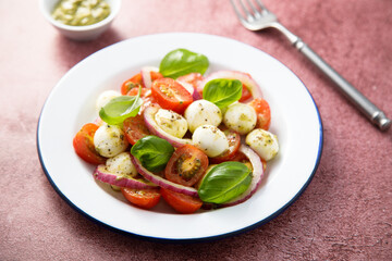 Tomato salad with red onion and cheese